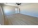 Expansive bedroom showcasing wood-style flooring and ample open space at 1131 Lupin St, Pahrump, NV 89048