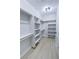 A bright closet with custom shelving and light wood flooring at 1131 Lupin St, Pahrump, NV 89048