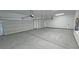 Spacious three car garage with white doors, offering ample parking space at 1131 Lupin St, Pahrump, NV 89048