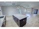 Open floorplan featuring a kitchen island with a marble countertop, perfect for entertaining and gatherings at 1131 Lupin St, Pahrump, NV 89048