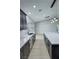 Open kitchen showcasing a spacious island, sleek countertops, contemporary lighting and modern finishes at 1131 Lupin St, Pahrump, NV 89048