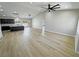 Bright and airy living room with vaulted ceilings and recessed lighting open to the kitchen area at 1131 Lupin St, Pahrump, NV 89048