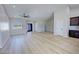 Open-concept living room featuring hardwood floors, vaulted ceilings, recessed lights, and natural light at 1131 Lupin St, Pahrump, NV 89048