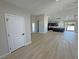 Open-concept living area with stylish flooring and abundant natural light at 1131 Lupin St, Pahrump, NV 89048