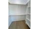 Spacious walk-in closet offers ample storage with custom shelving and hanging rods at 1131 Lupin St, Pahrump, NV 89048