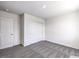 Well-lit bedroom with modern carpet and a double-door closet at 1301 Miller Springs Ln # Lot 93, North Las Vegas, NV 89084