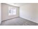 Bright bedroom featuring neutral walls, carpet, and a window offering natural light at 1301 Miller Springs Ln # Lot 93, North Las Vegas, NV 89084