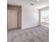 Bright bedroom featuring neutral walls, patterned carpet, and a window offering natural light at 1301 Miller Springs Ln # Lot 93, North Las Vegas, NV 89084