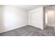 Bright bedroom with neutral walls, closet with sliding doors, and carpet at 1301 Miller Springs Ln # Lot 93, North Las Vegas, NV 89084