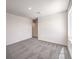 Bright bedroom featuring neutral walls, patterned carpet, and a window offering natural light at 1301 Miller Springs Ln # Lot 93, North Las Vegas, NV 89084