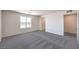 Bedroom features modern carpet, neutral walls, and a large window at 1301 Miller Springs Ln # Lot 93, North Las Vegas, NV 89084