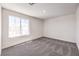 Bedroom featuring soft modern carpeting and a large sunny window at 1301 Miller Springs Ln # Lot 93, North Las Vegas, NV 89084