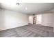 Expansive bonus room featuring neutral paint, gray carpet, and access to laundry room at 1301 Miller Springs Ln # Lot 93, North Las Vegas, NV 89084
