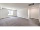 Spacious bonus room features plush gray carpeting and plenty of natural light at 1301 Miller Springs Ln # Lot 93, North Las Vegas, NV 89084