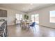 Inviting dining area with a modern table set, tile floors, natural light, and views of the backyard at 1301 Miller Springs Ln # Lot 93, North Las Vegas, NV 89084