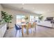 Bright dining area features modern furnishings, a large window, and an open layout connecting to the living space at 1301 Miller Springs Ln # Lot 93, North Las Vegas, NV 89084