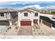 Inviting two-story home features a paver driveway, low maintenance landscaping, and a two-car garage at 1301 Miller Springs Ln # Lot 93, North Las Vegas, NV 89084