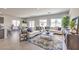 Expansive living space featuring a large seating area, stylish decor, and access to the dining room and kitchen at 1301 Miller Springs Ln # Lot 93, North Las Vegas, NV 89084