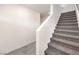 Carpeted staircase with white walls leading to the upper level of the home at 1301 Miller Springs Ln # Lot 93, North Las Vegas, NV 89084