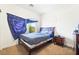 Relaxing bedroom featuring a bed, a window with natural light, and a nightstand at 135 Manor House Ave, Las Vegas, NV 89123