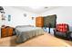 Spacious bedroom with a bed, and an armchair at 135 Manor House Ave, Las Vegas, NV 89123