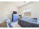 Comfortable bedroom featuring a dresser, a window with natural light, and neutral tones at 135 Manor House Ave, Las Vegas, NV 89123