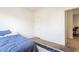 Cozy bedroom with a doorway, a white door, and natural light at 135 Manor House Ave, Las Vegas, NV 89123