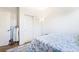 Bright bedroom featuring a patterned rug, white doors, and closet space at 135 Manor House Ave, Las Vegas, NV 89123