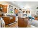 Open kitchen with center island, ample counter space, and adjacent dining area, perfect for Gathering gatherings at 135 Manor House Ave, Las Vegas, NV 89123