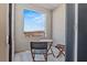 Outdoor balcony featuring a table and chairs, offering a cozy space to relax and enjoy the view at 137 Harmonica Ave # Lot 19, Henderson, NV 89015