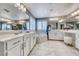 Bright bathroom with double vanity, soaking tub, and marble flooring at 1523 Great Sands St, Boulder City, NV 89005