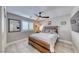 Bedroom showcasing wood-look floors, ceiling fan, and modern wooden bedframe with a luxurious padded headboard at 1523 Great Sands St, Boulder City, NV 89005
