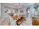 Bright dining room showcasing a wooden table, bench seating, chandelier, and decorative accents at 1523 Great Sands St, Boulder City, NV 89005