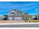 Beautiful two-story home with a three-car garage, covered car port and a charming front porch at 1523 Great Sands St, Boulder City, NV 89005
