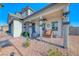 Charming front porch with wood chairs, rocking chair and tasteful decor at 1523 Great Sands St, Boulder City, NV 89005