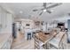 Open-concept kitchen featuring white cabinets, an island with seating, and stainless steel appliances at 1523 Great Sands St, Boulder City, NV 89005