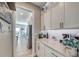 Bright kitchen with stainless steel appliances, white cabinets, and countertop decor at 1523 Great Sands St, Boulder City, NV 89005