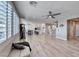 Open-concept living area with hardwood floors, neutral paint, and lots of natural light at 1523 Great Sands St, Boulder City, NV 89005