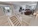 Upstairs view of a well-lit living room and office space with neutral-toned walls and wood-look flooring at 1523 Great Sands St, Boulder City, NV 89005
