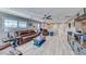 Cozy living room with leather seating, modern decor, and wood-look floors at 1523 Great Sands St, Boulder City, NV 89005