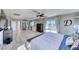 Large main bedroom with a balcony, wood-look flooring, and modern decor at 1523 Great Sands St, Boulder City, NV 89005