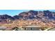 View of neighborhood rooftops with desert mountains in the distance at 1523 Great Sands St, Boulder City, NV 89005