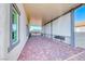 Spacious covered patio with brick pavers, offering shade and outdoor living space at 1523 Great Sands St, Boulder City, NV 89005