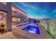 Inviting backyard with a modern pool and spa, perfect for relaxation and entertainment at 1523 Great Sands St, Boulder City, NV 89005