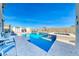 Sparkling pool and spa with sun loungers, umbrellas, and convenient pool house access at 1523 Great Sands St, Boulder City, NV 89005