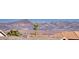 Picturesque view of desert landscape and mountains with palm trees at 1523 Great Sands St, Boulder City, NV 89005