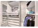 Organized walk-in closet with drawers, shelving, and hanging rods for optimal storage solutions at 1523 Great Sands St, Boulder City, NV 89005
