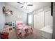 Bright bedroom features neutral walls, ceiling fan, and sliding closet with ample storage at 1553 Bright View Dr, Las Vegas, NV 89119