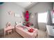 Charming bedroom is decorated with playful decor, cozy carpeting, and natural light, creating a whimsical and inviting space at 1553 Bright View Dr, Las Vegas, NV 89119