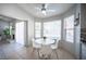 Bright breakfast nook features white table and chairs next to sunlit windows and fireplace, creating a cozy dining space at 1553 Bright View Dr, Las Vegas, NV 89119